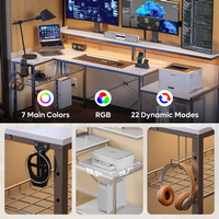 Bestier - L-Shaped Gaming Desk with Power Outlets, LED Lighting and Monitor Stand - White - Angle