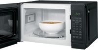 GE - 0.7 Cu. Ft. Spacemaker Countertop Microwave Oven - Black on Black - Angle