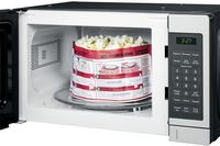 GE - 0.7 Cu. Ft. Compact Microwave - Stainless steel - Left View